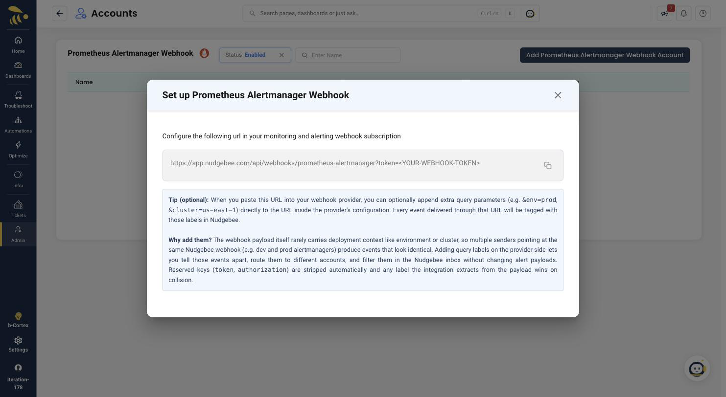 The Set up Prometheus Alertmanager Webhook dialog showing the generated webhook URL with its token